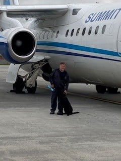 Paul Paquin outside of plane with drug dog